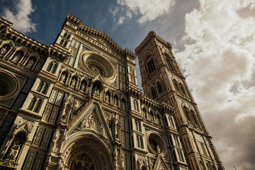 Santa Maria delle Fiore cathedral in Florence, Italy. Picturesque view of beautiful famous building. The dome of the Cathedral Santa Maria dell Fiore and the Palazzo Vecchio tower.