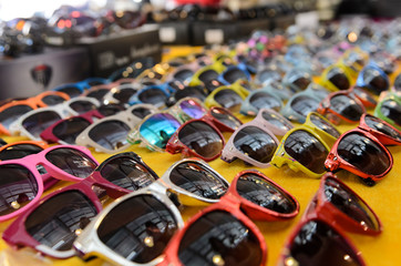 rows of multi colored sunglasses