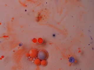 Abstract photography. Multicolored spheres, streaks and spots on a light background. Red, yellow,...