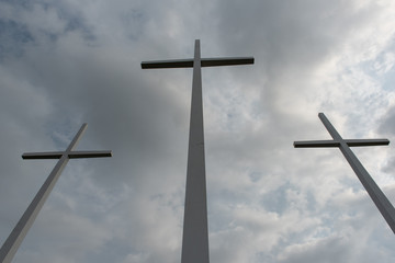 Three crosses with dark sky
