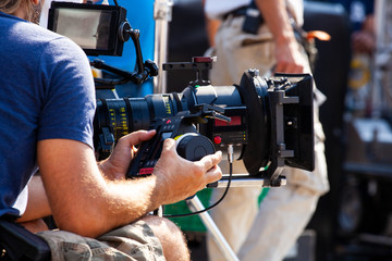 Focus puller hold the wireless follow focus system during the filming process...