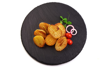 Baked potatoes on stone plate, isolated on white background