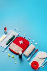 Flat lay Medicines and devices for first aid, bandages, painkillers, plaster, cotton wool, tampon...