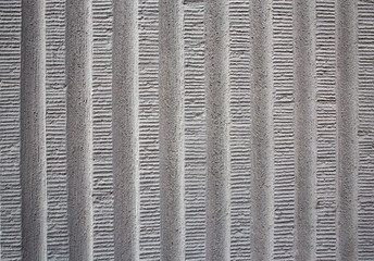 Striped gray concrete exterior wall