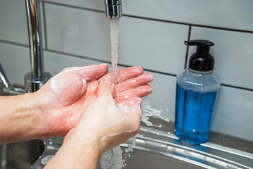 Fototapeta premium Washing hands with soap and hot water. Disinfect and kill germs. 20 second wash.