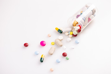 Pills spilling out of pill bottle