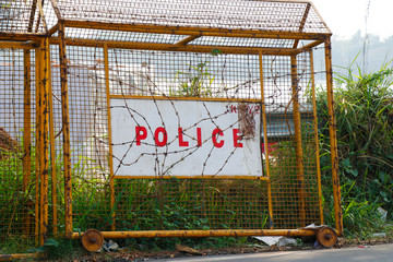 Wire fence or chain link protection with gate or wicket. Chainlink construction for police or prison, military. Chained boundary or enclosure, cage entrance. Steel linkage or barrier, protection theme