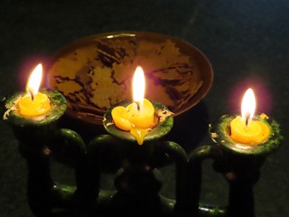 Three burning candles