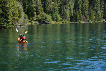 Fototapeta na wymiar SOUTH LAKE TAHOE, CALIFORNIA, USA - AUGUST 21, 2019: Kayaking at Emerald Bay on Tahoe Lake