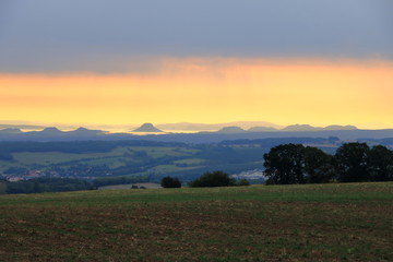 Fototapeta premium Sunrise over the Saxon Switzerland, rocks Lilienstein, fortress Koenigstein