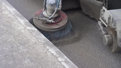 The special car cleans city road. Detail of a street sweeper machine.