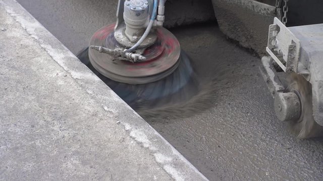 The special car cleans city road. Detail of a street sweeper machine.