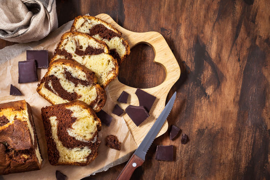 Delicious homemade marble pound cake  on wooden background, top view
