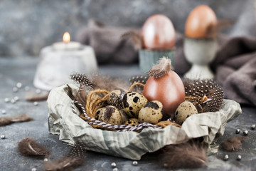 Easter painted shine pearl eggs and feathers,  spring holiday concept