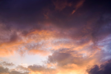 Fototapeta premium yellow and orange clouds at sunset. dramatic sky skyline background 