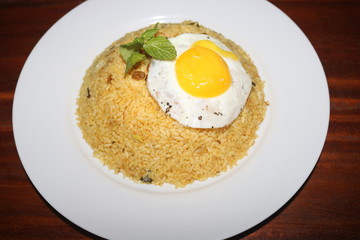 nice food dish of yellow rice with egg omelette image