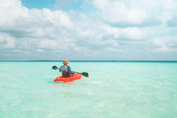 Man navigating in kayak the Bacalar Lagoon, near Cancun in Riviera Maya, Mexico