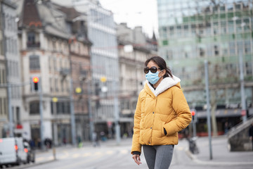 The image face of a young Asian woman wearing a mask to prevent germs, toxic fumes, and dust....