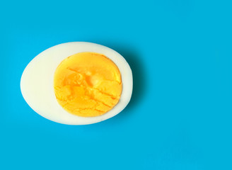 Boiled eggs cuts in half on light background.