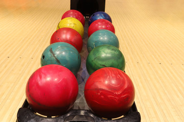 Fototapeta na wymiar Bowling alley, colored balls in the bowling alley.