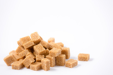 Brown sugar on a white background, healthy sugar used for cooking or desserts.