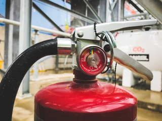 Fire extinguisher cylinder in the industrial construction area.