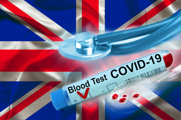 test tube with coronavirus blood test, medical stethoscope, lies on the silk national flag of Great...