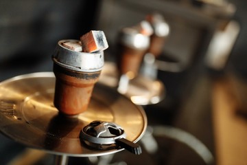  hookah bowl with tobacco and coals on a hookah