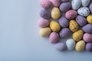 Naklejka na ściany i meble Colorful mini Easter eggs on a plain back ground with copy space