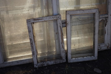 old dirty windows with white wooden frames
