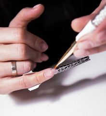 Extension of nails on the form using a disposable stencil sticks