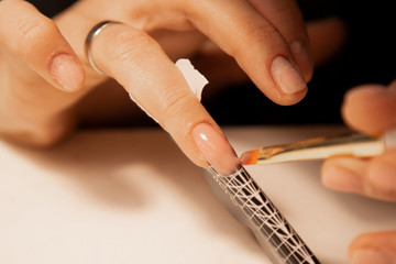 extension of nails on the little finger shape using disposable tips