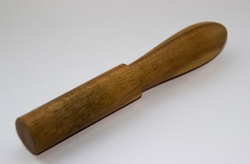 wooden pestle on a white background