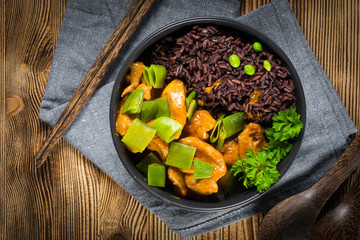 Thai red curry with chicken and black rice.
