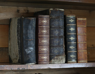 old books on wooden shelf.
