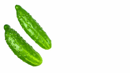 Green cucumbers on a white background isolate