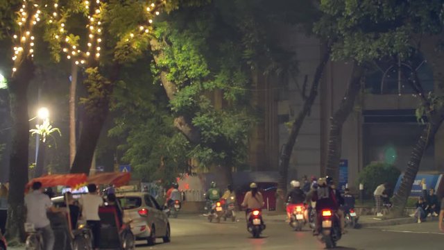Unrecogniable people on the street of Hanoi, Vietnam.