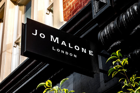 London, UK - August 1st 2018: Luxury perfume and fashion brand Jo Malone brand logo on a sign in the storefront in the iconic Covent Garden in London, England