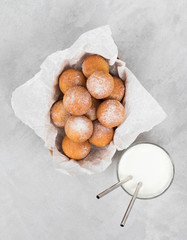 Cottage cheese balls deep-fried with powdered sugar and milk