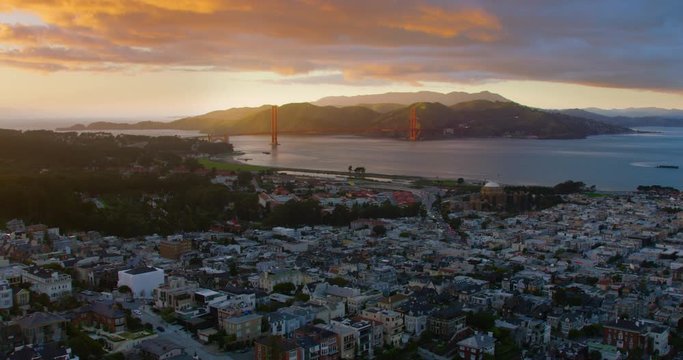 Aerial view of a residential neighborhood in San Francisco, California. United States. the Golden Gate Bridge in the background. Shot on Red weapon 8K.