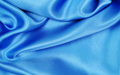Obraz premium Smooth elegant blue silk or satin luxury cloth texture as abstract background. Luxurious background design