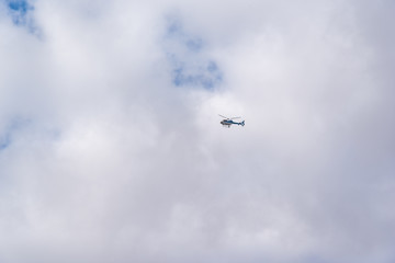 Fototapeta na wymiar Buenos Aires, Argentina; March 24, 2019: A helicopter flying in the middle of the sky