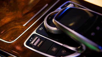 Automatic gear stick of a modern car. Modern car interior details. Close up view. Car detailing. Automatic transmission lever shift. Shallow dof