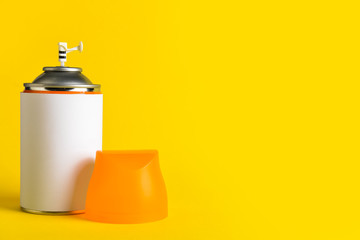 Bottle of air freshener on color background
