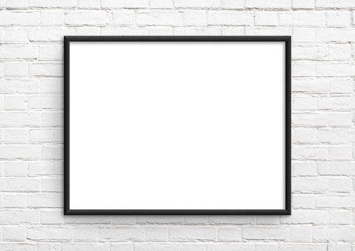 Empty frame. Blank black landscape frame on white brick wall