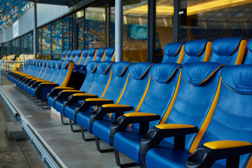 blue chair on sport stadium