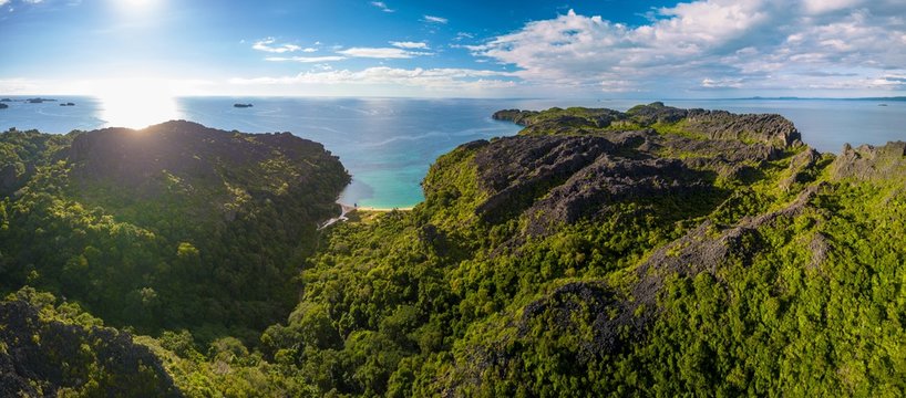 drone aerial panorama of pristine uninhabited island with bizarre tsingy rock formation/ madagascar/ nosy hara 