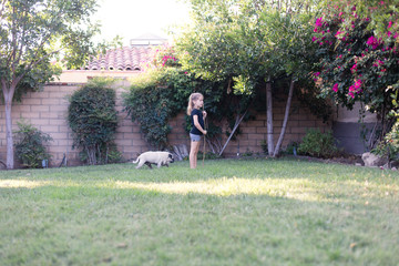 Sisters are exploring their new backyard in their small home in Los Angeles, California.