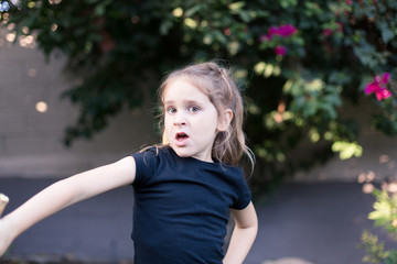 Sisters are exploring their new backyard in their small home in Los Angeles, California.
