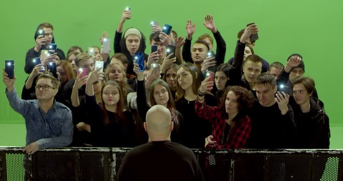 GREEN SCREEN Front view huge crowd of people with phones in hands at live concert or show. Shot on RED Helium 8K, Prores 4444